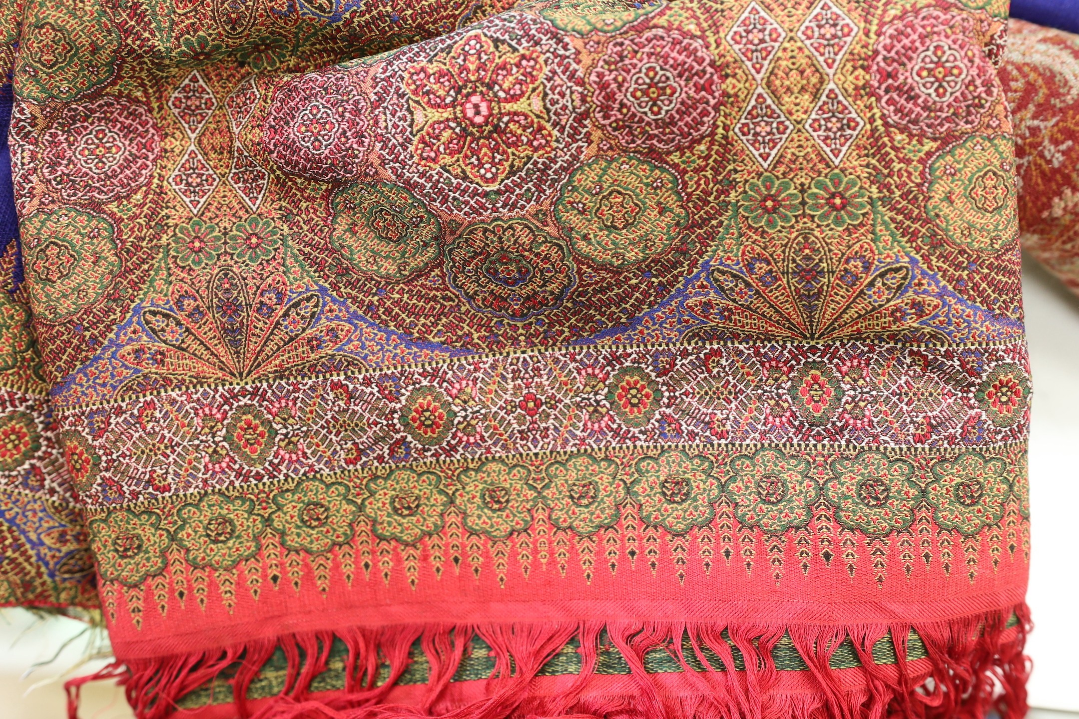 Large19th century paisley shawl and similar silk paisley shawl, cut into panels.